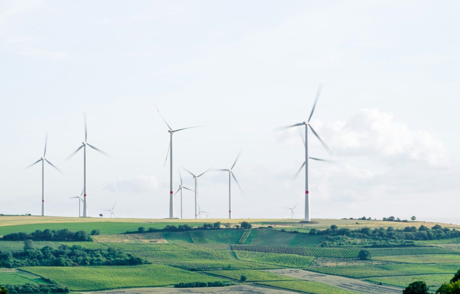 windmill surrounded by grass during daytime