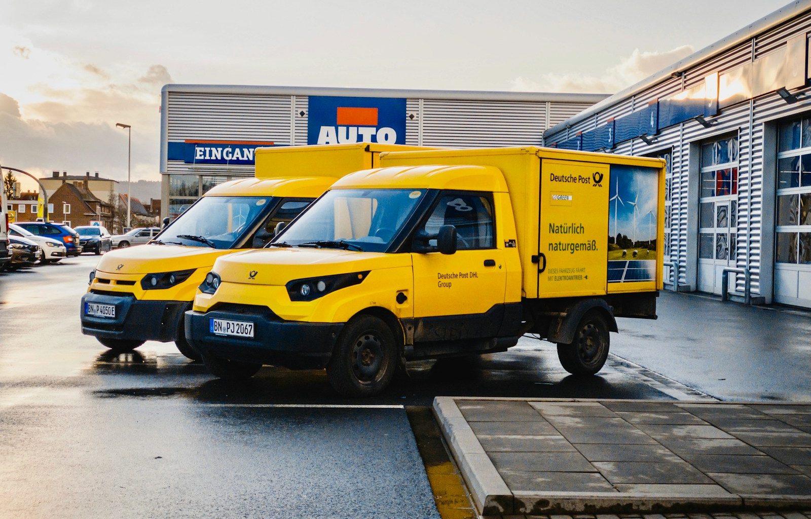 yellow and blue van on road during daytime