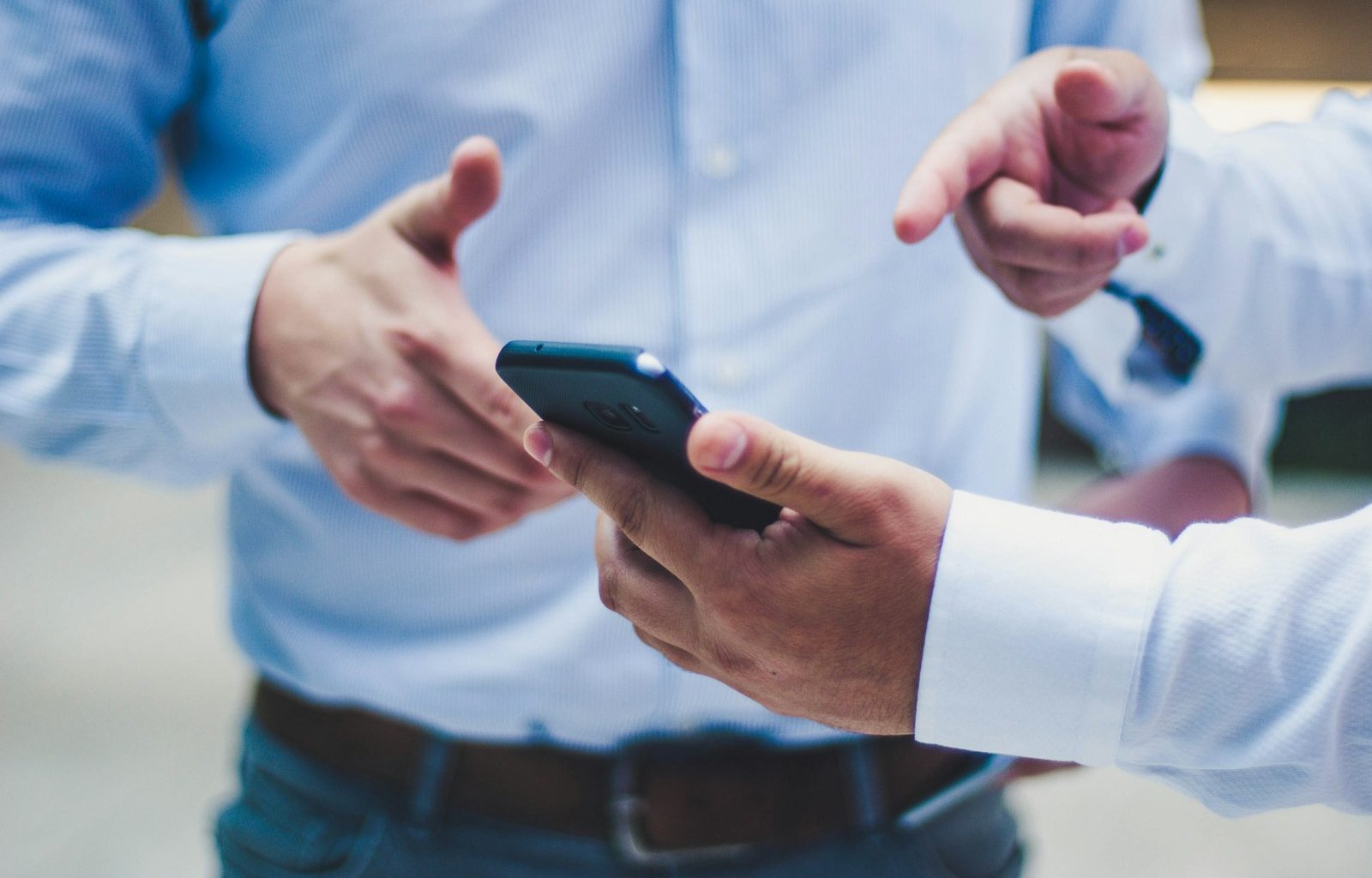 person holding black smartphone