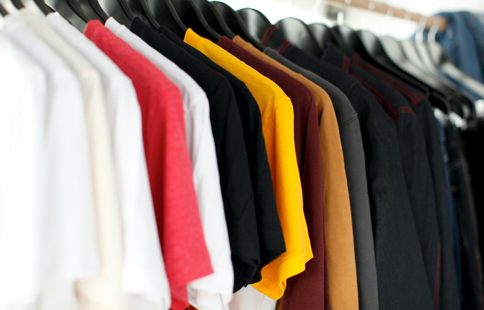 closeup of hanged shirts on rack