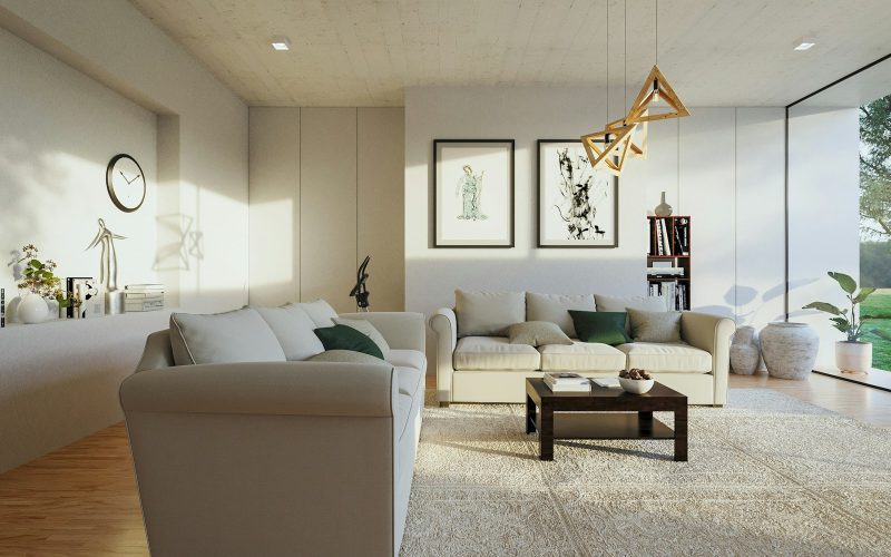 a living room filled with furniture and a large window