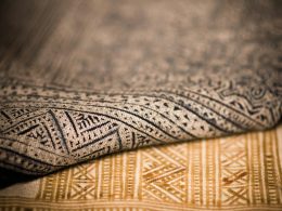 A close up that shows the texture of two different patterned rugs