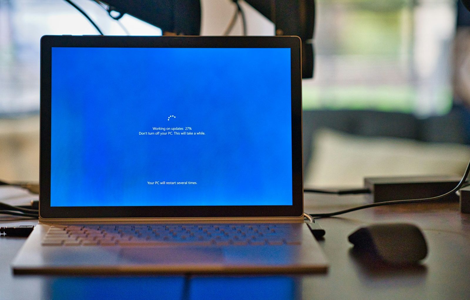 macbook pro on brown wooden table