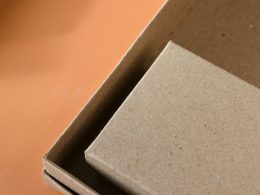 an open cardboard box sitting on top of a table