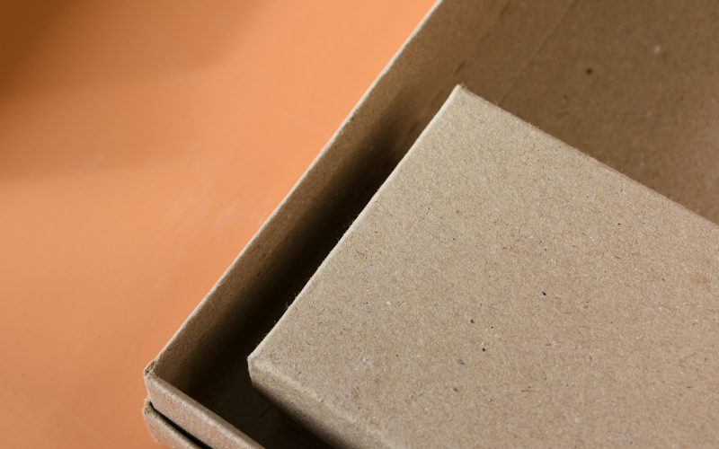 an open cardboard box sitting on top of a table