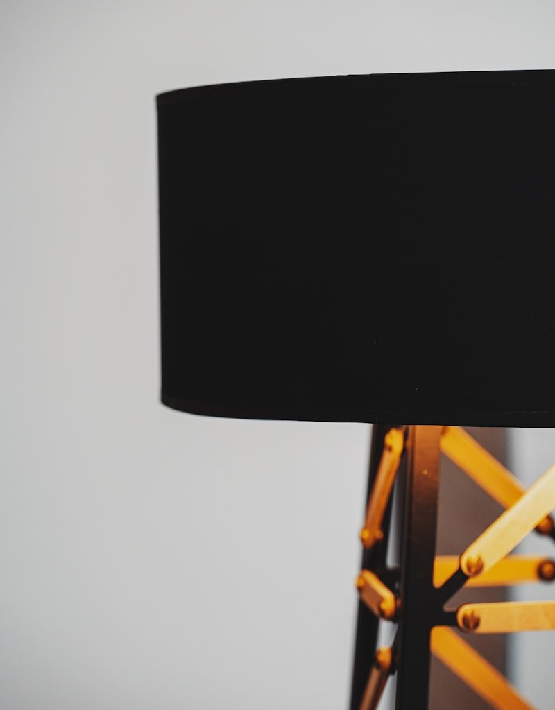 black table lamp on brown wooden table