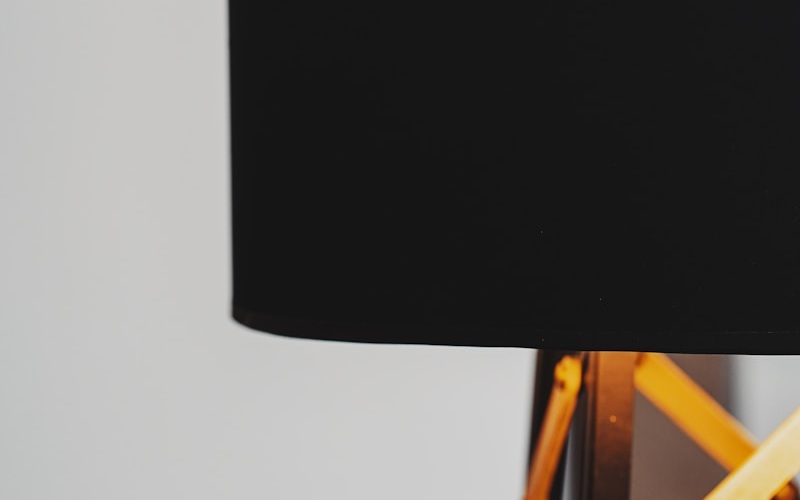 black table lamp on brown wooden table