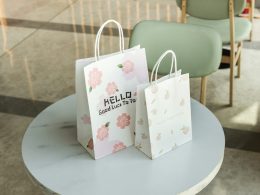 a couple of shopping bags on a table