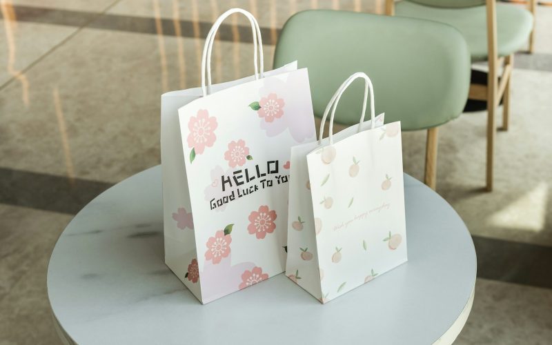 a couple of shopping bags on a table