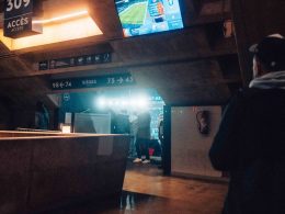 a man is standing in a subway station