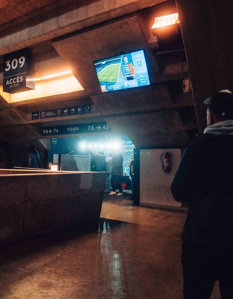 a man is standing in a subway station