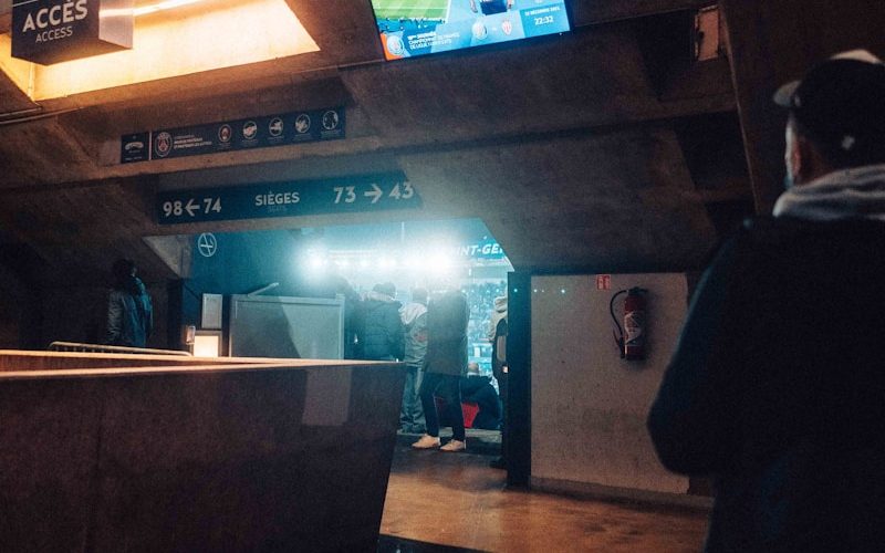 a man is standing in a subway station