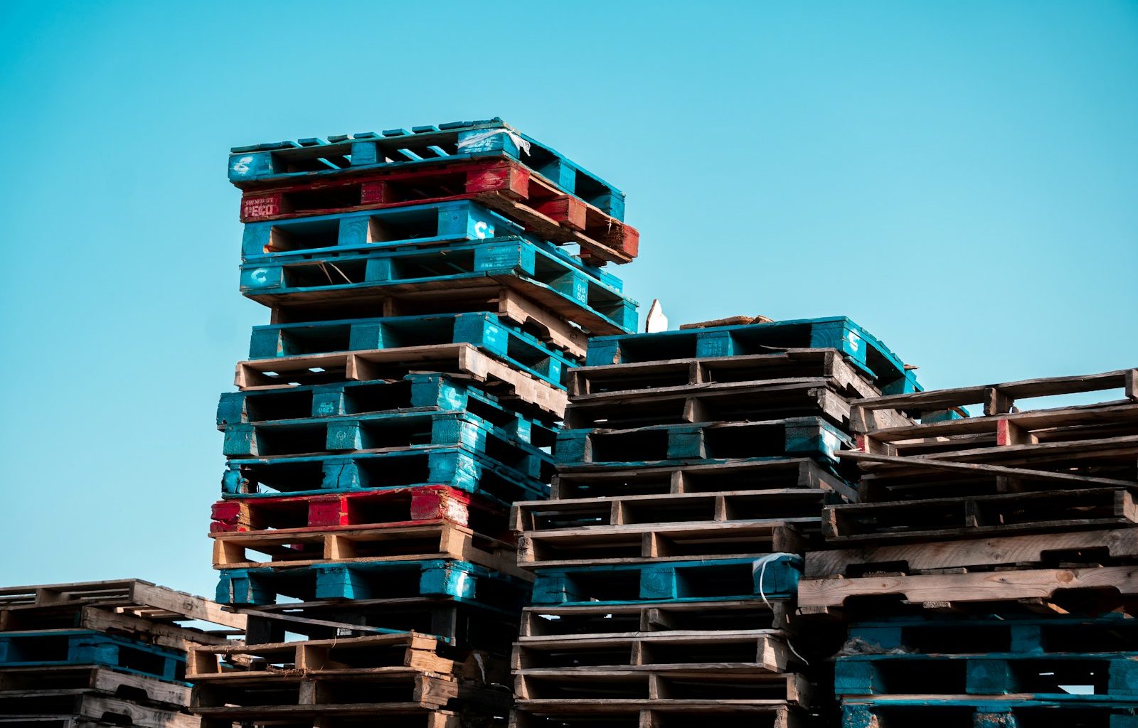 a pile of wooden pallets stacked on top of each other