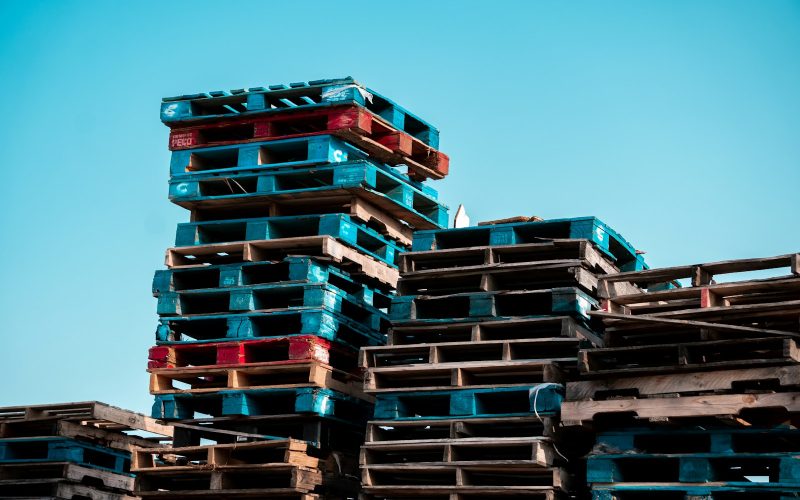 a pile of wooden pallets stacked on top of each other