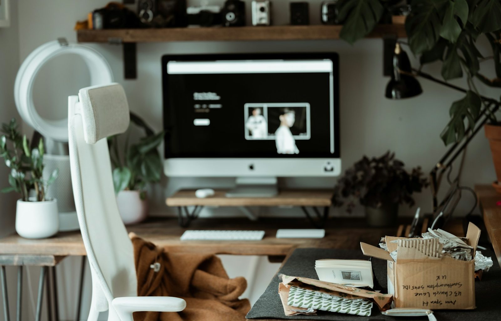 black flat screen tv on brown wooden tv rack