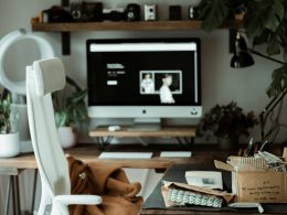 black flat screen tv on brown wooden tv rack