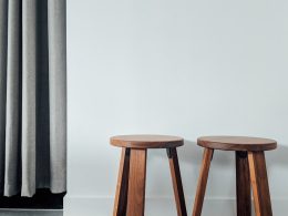 two brown wooden stools