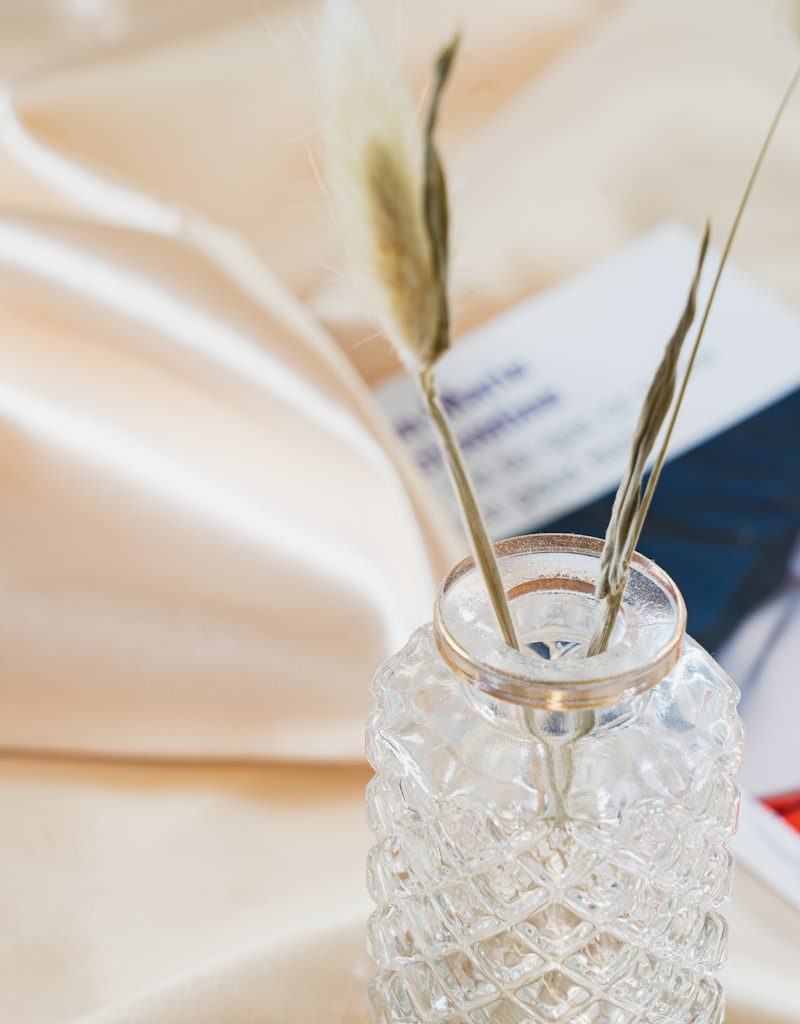 clear glass jar with silver spoon