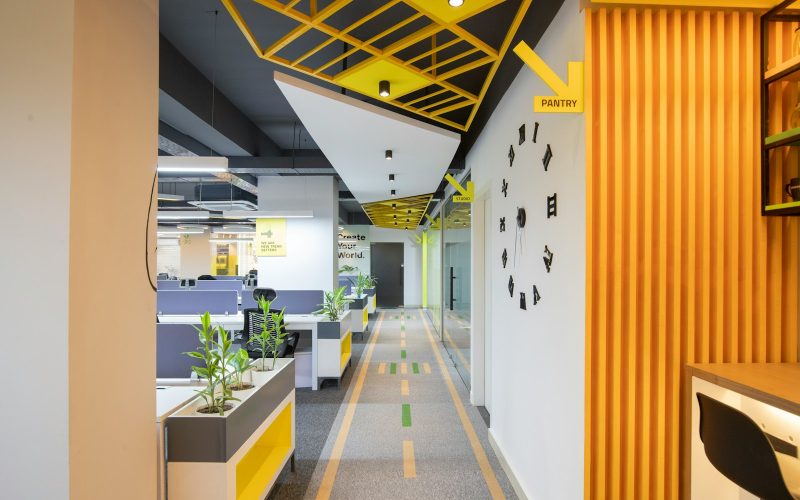 a long hallway with yellow and black accents