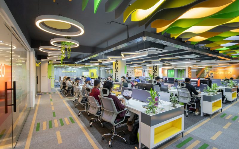 a large open office space with many desks and chairs