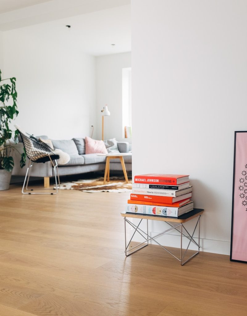 books on brown wooden stool